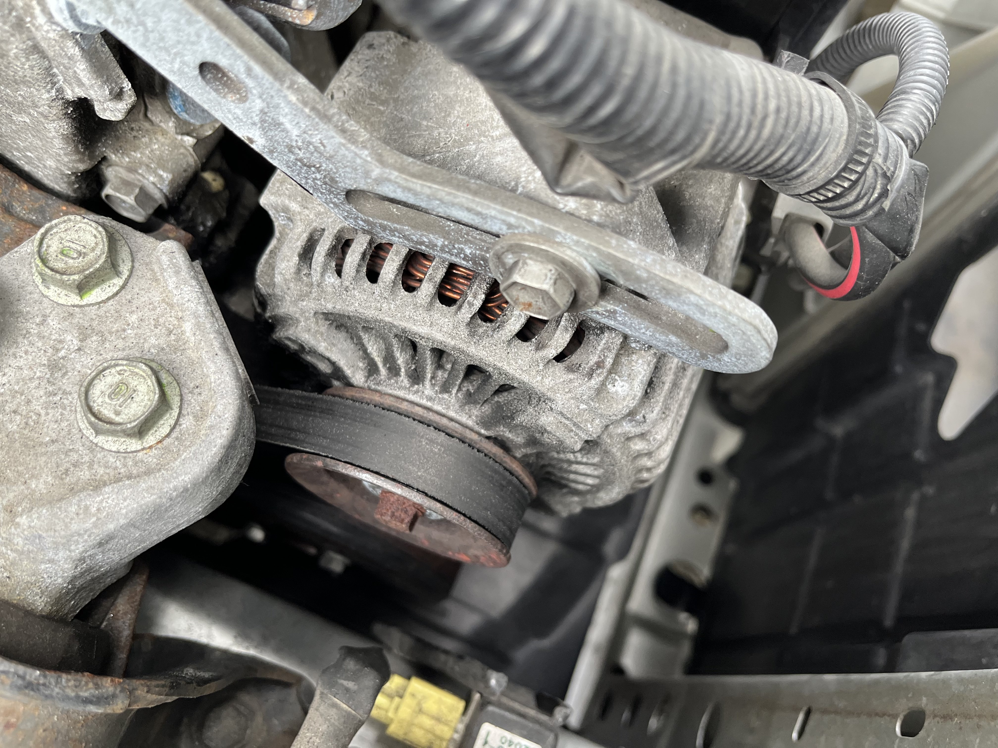 Worn alternator belt before replacement